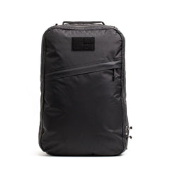 Black GORUCK tactical backpack with diagonal zipper pocket and handle on white background