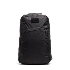 The GR1 USA - Waterproof X-PAC is a black rucksack featuring a front diagonal zipper pocket, shown upright against a white background—ideal durable gear for everyday adventures.