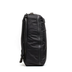 Side view of black GORUCK tough, water-resistant rucking backpack with durable fabric and zipper detailing