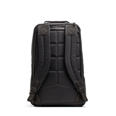 Back view of rugged black GORUCK backpack with padded straps and quilted back panel