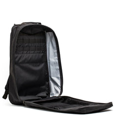 Open black GORUCK rucksack showing organized compartments and MOLLE webbing interior