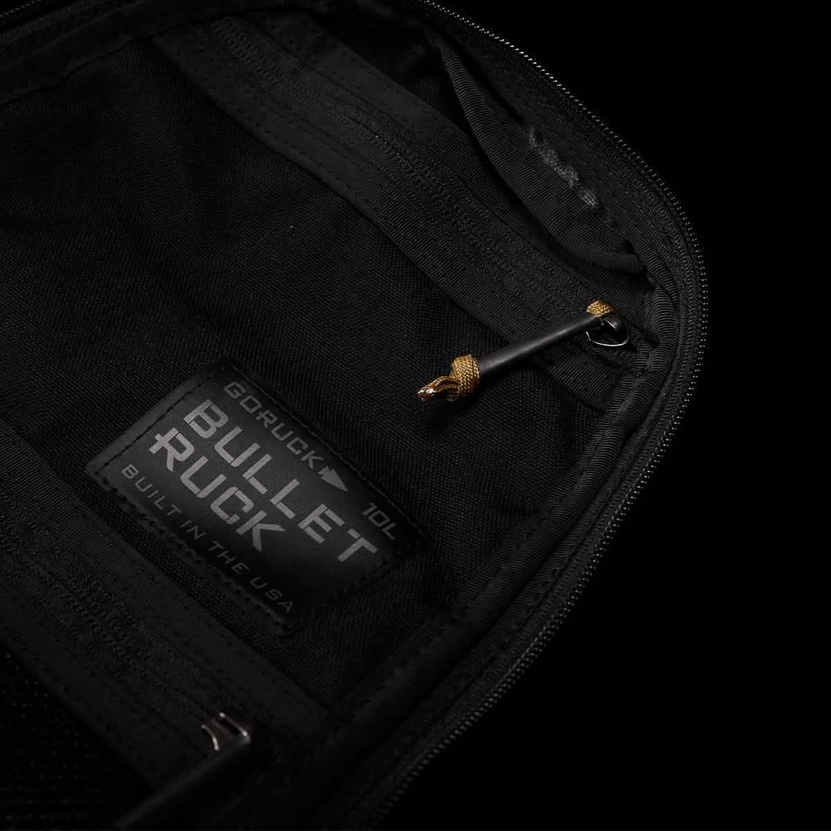GORUCK Bullet Ruck 10L interior with branded patch and zipper on black fabric