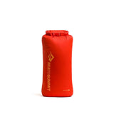 Bright orange Sea to Summit lightweight dry bag for rucking gear, on white background