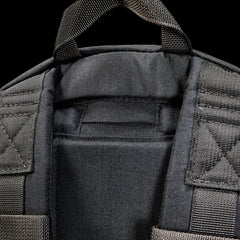 Close-up of the top part of the Bullet Ruck USA Throwback, a black tactical daypack featuring padded straps, a carrying handle, and durable CORDURA construction.