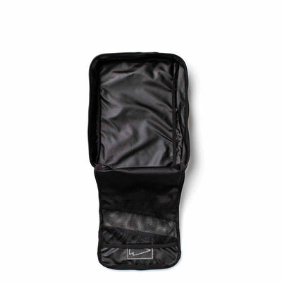 Introducing the Black Shoe Bag - Ripstop ROBIC® by GORUCK, featuring multiple compartments, including mesh pockets. This water-resistant bag is expertly designed for organizing personal items and comes with a lifetime guarantee. It is displayed on a white background, highlighting its practical interior design.