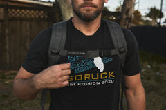 Man wearing a black "GORUCK Ruck Reunion 2020" t-shirt outdoors, ready for weighted training with his RPC 3.0 + 10lb Ruck Sandplate.