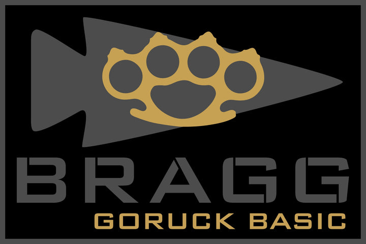 A gold brass knuckle over a gray arrowhead, symbolizing Special Forces training, above "BRAGG EVENT WEEKEND 2026" text on a black background.