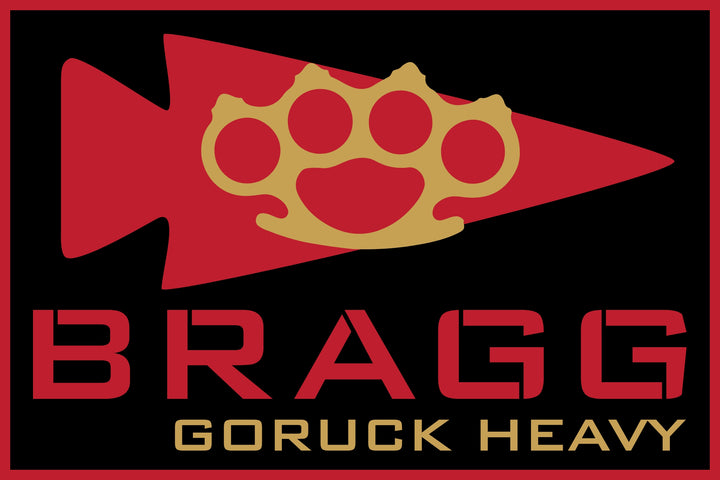 Red arrowhead with gold brass knuckles and bold "BRAGG" and "BRAGG EVENT WEEKEND 2026" text below—a tribute inspired by GORUCK Heavy and Special Forces training.