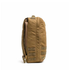 The GR1 USA - Cordura (The Original Ruck), a tan tactical backpack with side straps and a top handle, is showcased from the side against a white background.