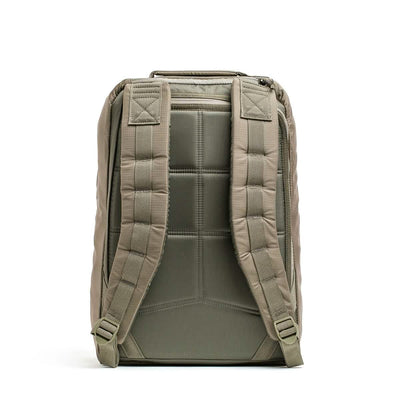 Back view of the GORUCK GR1 USA - Ripstop ROBIC® rucksack in green, showcasing padded, adjustable shoulder straps, a quilted back panel for added comfort, and an ultra-lightweight fabric design.