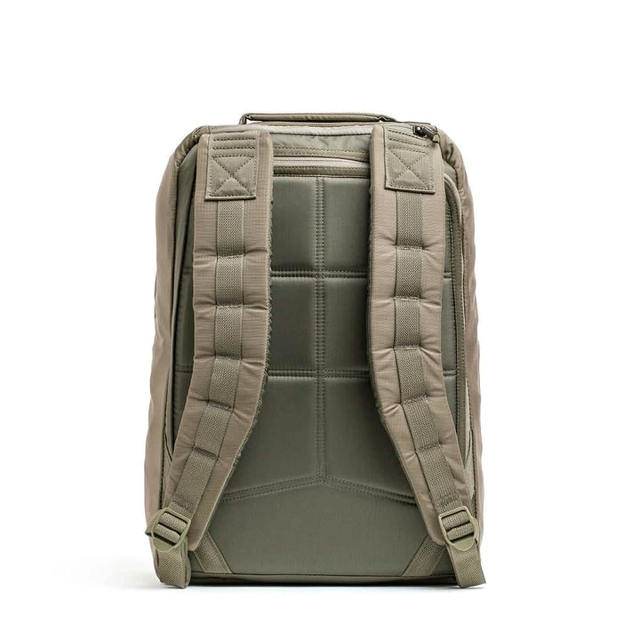 Back view of the GORUCK GR1 USA - Ripstop ROBIC® rucksack in green, showcasing padded, adjustable shoulder straps, a quilted back panel for added comfort, and an ultra-lightweight fabric design.