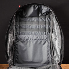Inside view of GORUCK tactical backpack showing black interior with MOLLE webbing and internal pocket