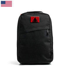 The GR1 USA x Carryology - GRXC2 Samurai is a black backpack with a red patch and an American flag in the top left corner, made from premium Japanese cotton for outstanding durability.