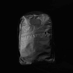 GORUCK durable black rucksack with weather-resistant fabric and angled zipper pocket on black background