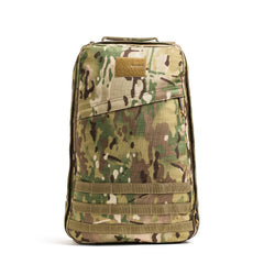 The GR1 USA - Cordura, a camouflage-patterned rucksack with front zipper pocket and MOLLE webbing, stands upright—a true Special Forces backpack.