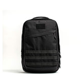 GORUCK 26L black rucksack with MOLLE webbing, rugged tactical backpack on white background