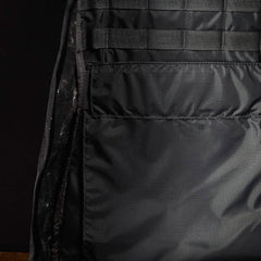Close-up of black GORUCK rucksack interior with durable fabric and sewn compartments