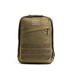 Introducing the GR2 - Cordura by GORUCK: a durable green tactical ruck featuring multiple compartments and a top handle. This rugged bag includes a front zipper pocket, MOLLE webbing for attachments, and draws inspiration from Special Forces design. It's meticulously crafted for durability and functionality, making it ideal for outdoor or tactical use.