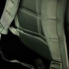 Close-up of padded green tactical backpack straps designed for durable rucking gear by GORUCK