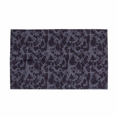 The GORUCK Patch Board is a rectangular Cordura fabric panel featuring a black and dark gray camouflage pattern and corner metal grommets.