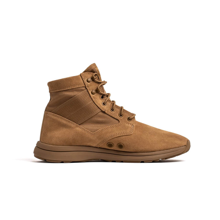 The MACV-1 Hi-Speed - Mid Top from GORUCK features a brown suede boot with a high-top design, sturdy laces, and a padded collar for support. Its lightweight sole is both rugged and durable, making it perfect for outdoor adventures. The boot is displayed in profile view against a white background.