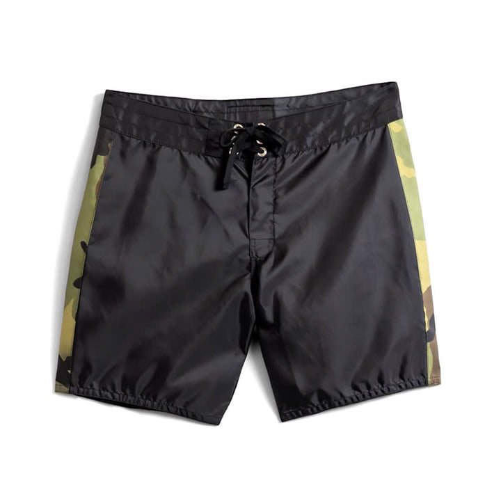 The 300 Boardshorts – GORUCK are black men's boardshorts featuring camouflage side panels and a SurfNyl lace-up drawstring closure at the waist. Made in the USA, these shorts are shown against a white background.