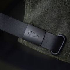 Tac Hat - Heritage with matte buckle featuring an engraved arrowhead symbol, shown against dark green fabric.
