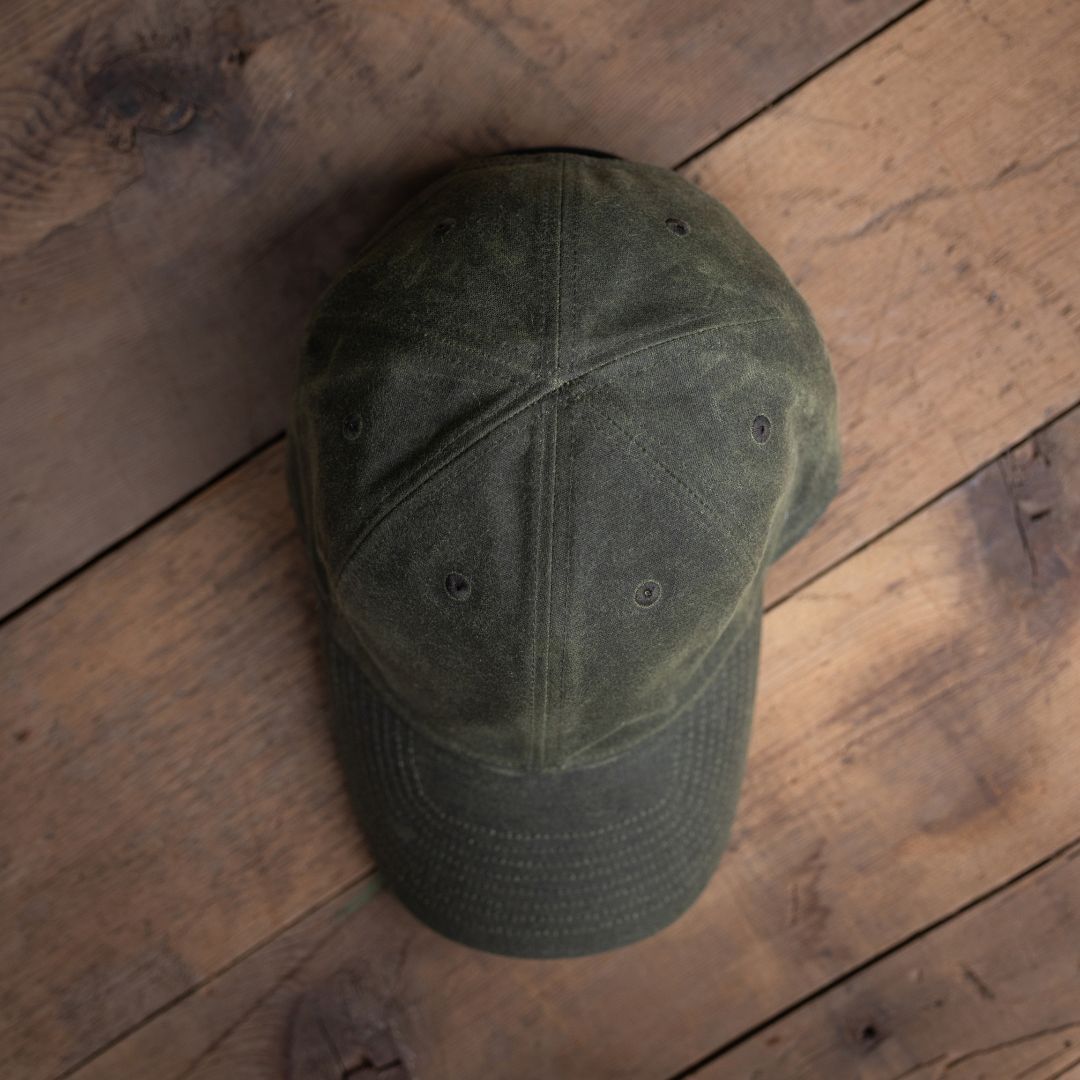 Tac Hat - Heritage displayed on a wooden surface, viewed from above.
