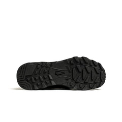 Black rugged outsole of a GORUCK rucking shoe with deep tread and tree logo in center