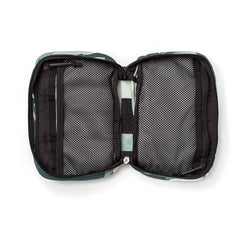 Introducing the GR1 Field Pocket x Gear Patrol by GORUCK: a sleek rectangular pouch featuring a distinctive Variegated Elephant Ear Camo pattern in dark green and black. The interior is equipped with mesh pockets and zippered compartments, ideal for your next Gear Patrol, ensuring your essentials stay organized while maintaining a discreet style.