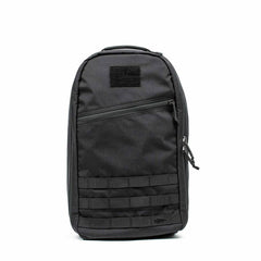 The Bullet Ruck Classic - Cordura is a black, slim daypack with a streamlined design. It features a front zipper pocket, a top patch area, and extra padded straps for enhanced comfort in its minimalist style.