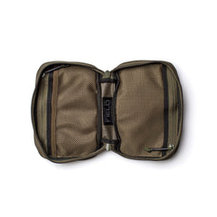 The GR1 Field Pocket - USA in olive green features two zippered mesh compartments and a central fabric label, making it perfect as a dopp kit or electronics organizer.