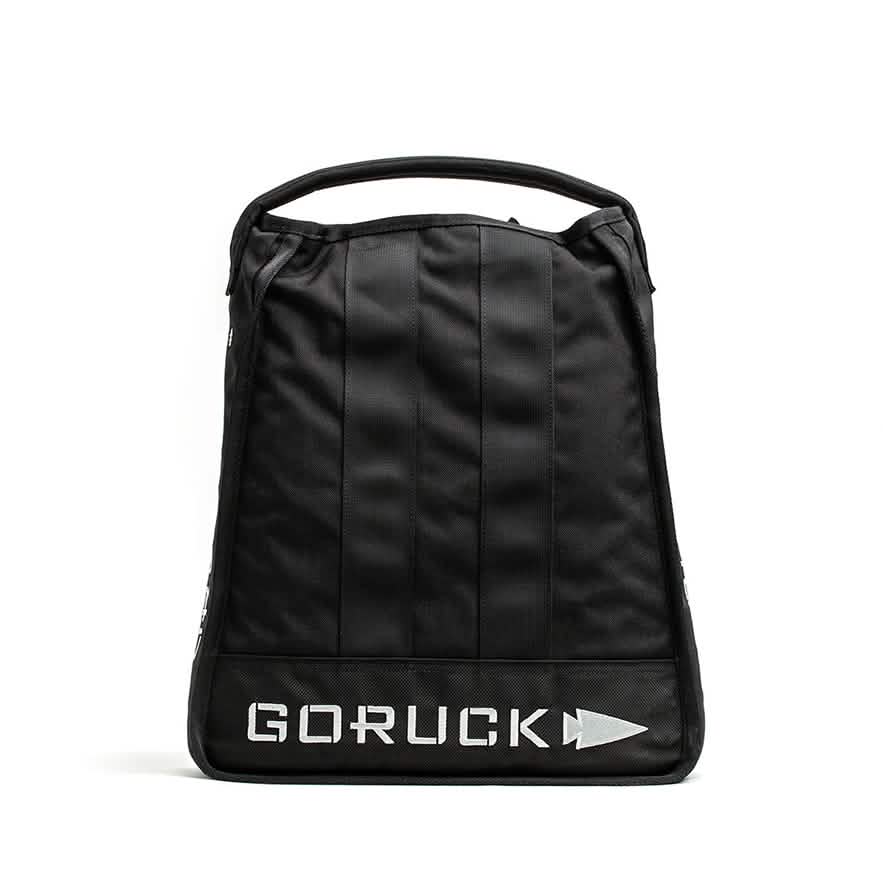 Introducing the Sand Jerry Can by GORUCK: a black backpack featuring a sleek, minimalist design constructed from Special Forces Grade materials. It includes a practical top handle, and the 