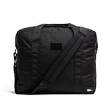 GORUCK black tactical ruck bag with shoulder strap on white background