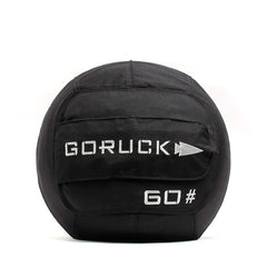 The GORUCK Sand Medicine Ball in black, featuring "GORUCK" and "60#" in white, includes a reinforced handle for lifting. Ideal for fitness and weight training, it's perfect for enhancing core stability in your home gym.