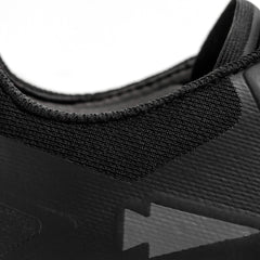 Close-up of black GORUCK tactical shoe collar with textured fabric and arrow logo detail