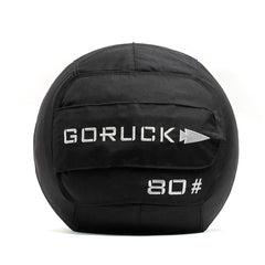 A black Sand Medicine Ball by GORUCK, featuring a handle, is perfect for boosting core stability at home. The ball is marked with the brand name GORUCK and the number 80# in white text, making it a versatile piece of equipment for your home gym collection.