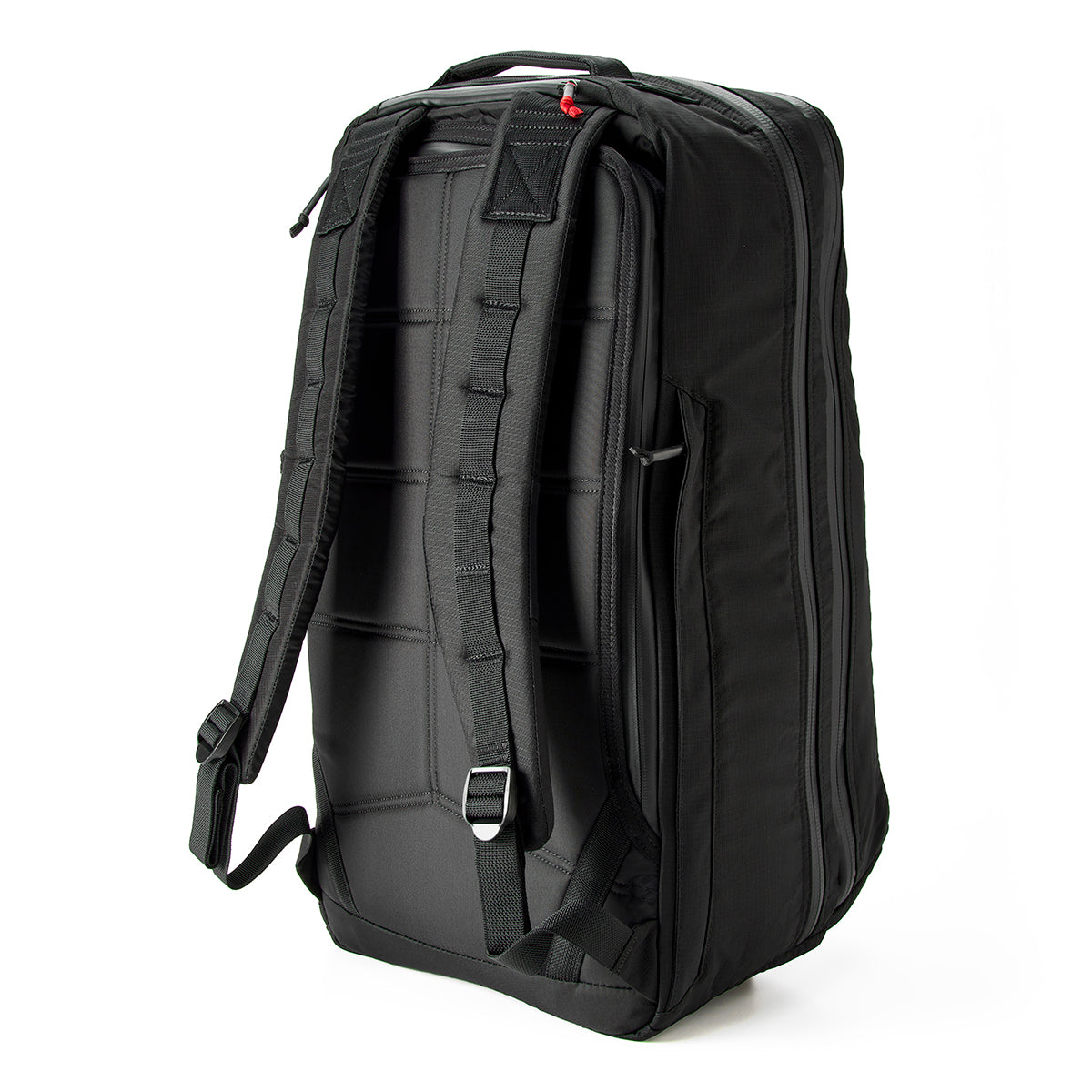 The GR2 - Ripstop ROBIC® - Michael Easter black backpack, crafted from durable 420D ROBIC Ripstop Nylon, stands upright with its padded back and adjustable shoulder straps.
