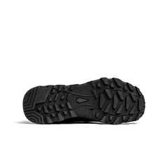 Black rugged outsole of a GORUCK rucking shoe with deep treads and a logo in the center