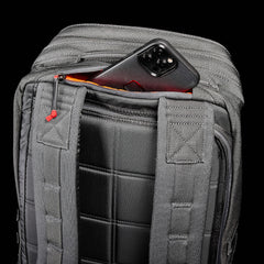 The GR2 - Ballistic Nylon Cordura rucksack in black features a zippered pocket behind the shoulder straps for your phone—perfect as a carry-on travel bag.