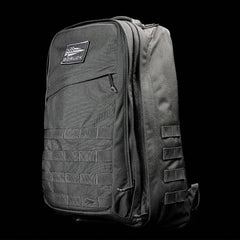 The GR2 - Ballistic Nylon Cordura rucksack in black features multiple compartments and webbing, displayed against a black background.