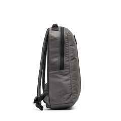 Side view of the Basic Rucker in gray with black straps and a zipper, designed for rucking, standing upright on a white background.