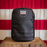 The 13 Stars GR1 21L - Built by Scars in black with a flag patch, displayed before an American flag.