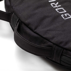 Close-up of a Bulgarian Sandbag in black with reinforced construction, a handle, and partially visible white embroidered text.