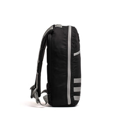 Side view of a black and speed grey GORUCK BULLET16L durable rucking backpack with padded straps and multiple compartments