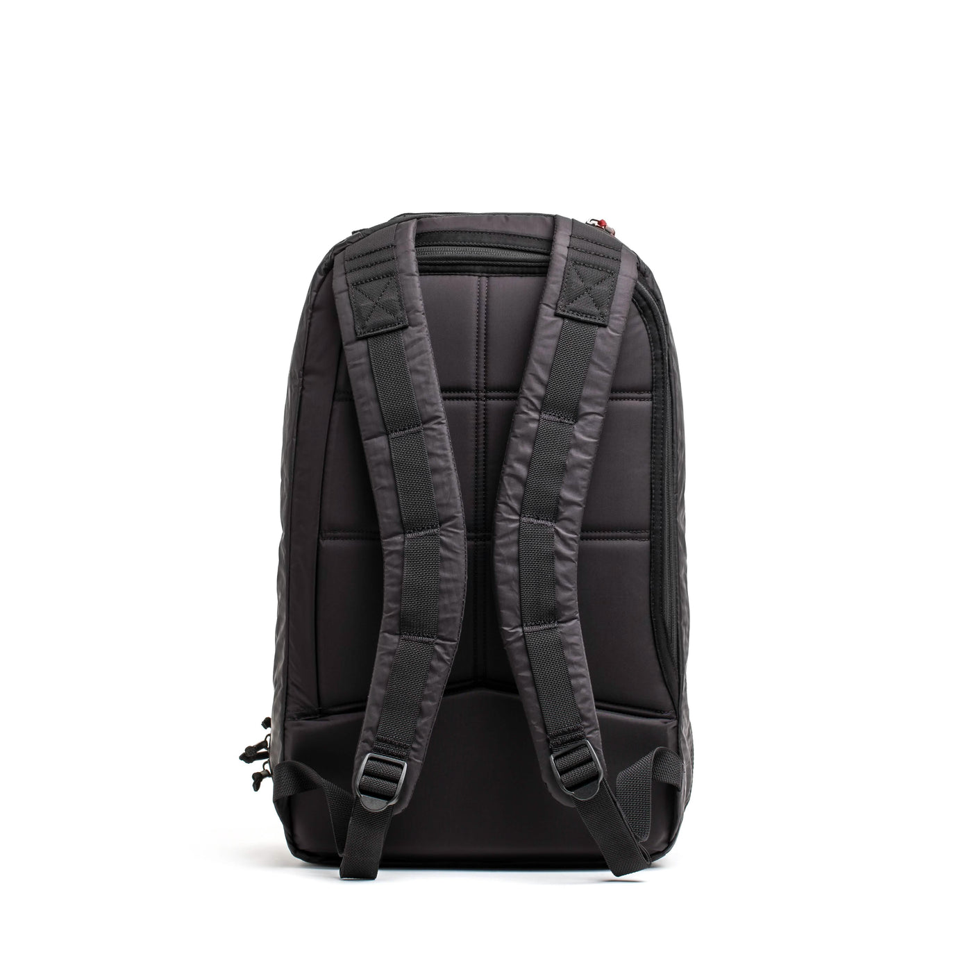 The GORUCK Bullet Ruck Double Compartment - Dyneema is showcased in black with durable construction. Featuring padded, adjustable shoulder straps and a quilted back panel for enhanced comfort, its practical design includes zippers and side pockets ideal for everyday use. This backpack also offers the added benefit of a lifetime guarantee.
