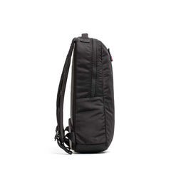Side view of the black Basic Rucker® with a slim profile, visible zipper, and adjustable shoulder straps—perfect as a rucking backpack for fitness enthusiasts.