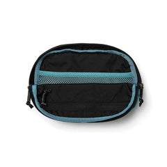 The GORUCK Belt Bag is a circular black pouch with a blue border that opens to reveal its compact interior. It includes two compartments: a mesh pocket at the top and a solid zippered section below. Crafted from durable Cordura fabric, this bag is perfect for organizing essentials while on the move.