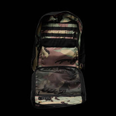 Open GORUCK rucksack showing interior camouflage fabric, mesh pocket, and organization straps