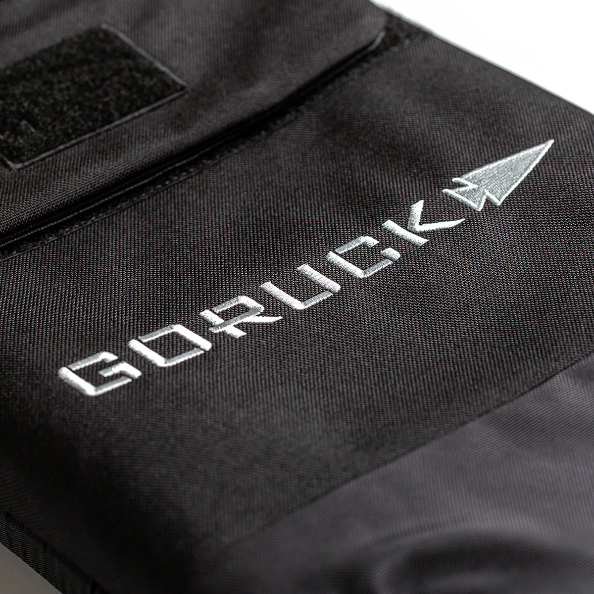Close-up of a black fabric bag with white 